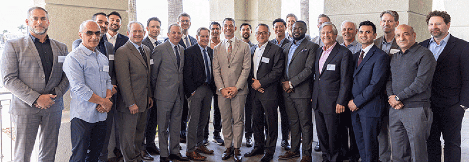 photo of many surgery department people all in suits